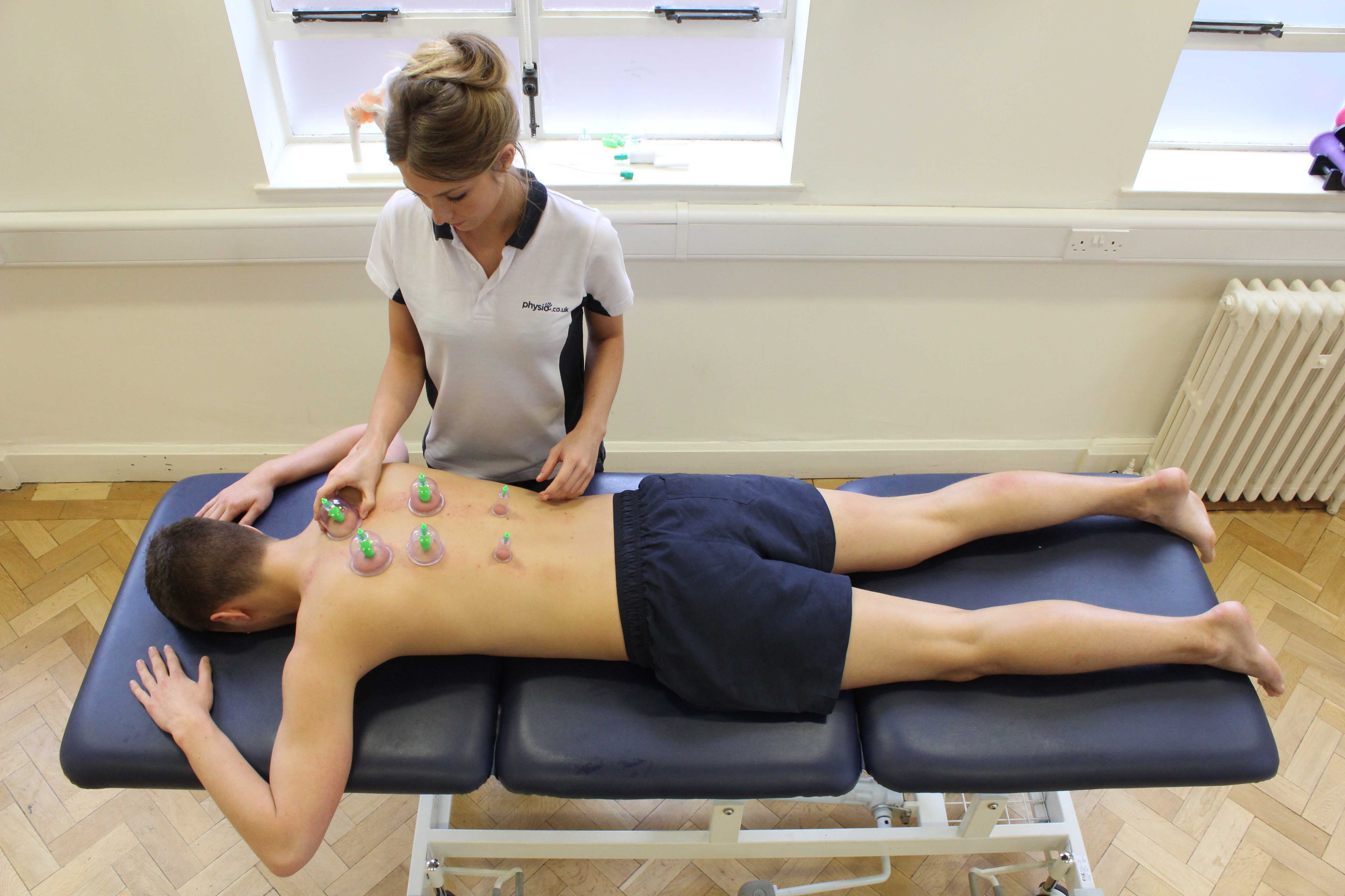 Doctor evaluating spine at MIT Physiotherapy